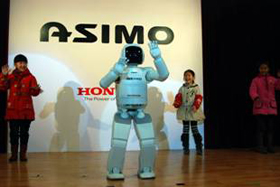 類人型機器人ASIMO赴都江堰演出-ASIMO和孩子們一起跳舞